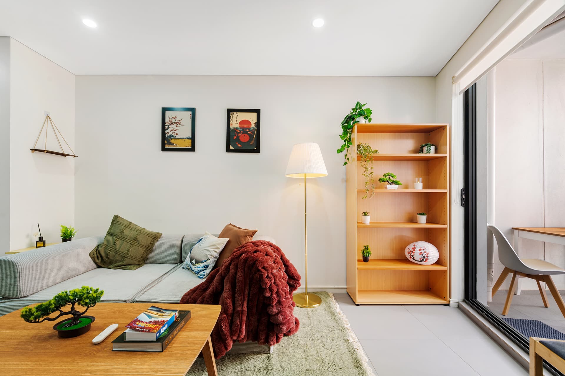 Sunlit boutique apartment living room with Sydney skyline views